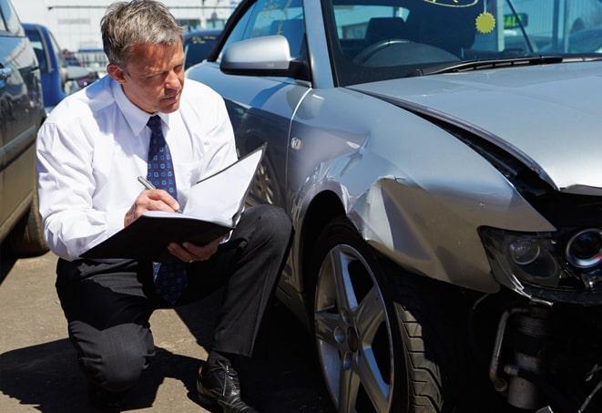 family buying car insurance at agency office